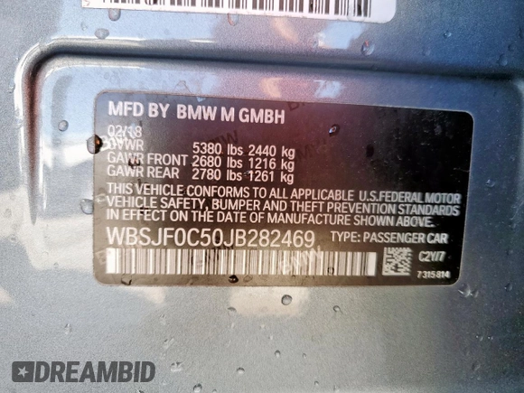 2018 BMW M5 z VIN WBSJF0C50JB282469, wystawiony jako Copart lot #46794335 z przebiegiem Nie podano mil oraz Szkody całkowita. Historia ofert i sprzedaży dostępna na DreamBid. Obrazek 12.