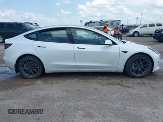 2023 Tesla Model 3 with VIN 5YJ3E1EA5PF407054, listed as a IAAI auction lot 42313770 with 57,621 mi miles and . Bid and sale history available at DreamBid. Image 13.