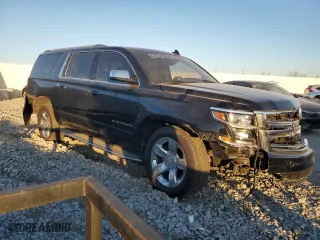 2017 Chevrolet Suburban Premier with VIN 1GNSKJKC5HR303600, listed as a Copart auction lot 83395644 with 124,465 mi miles and Salvage Title. Bid and sale history available at carsss.com. Image 4.