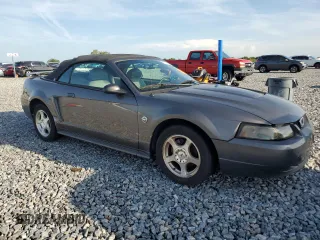 2004 Ford Mustang Deluxe z VIN 1FAFP44674F177195, wystawiony jako Copart lot #65935855 z przebiegiem 928 945 mil mil oraz Czysty tytuł • Clean title. Historia ofert i sprzedaży dostępna na DreamBid. Obrazek 4.