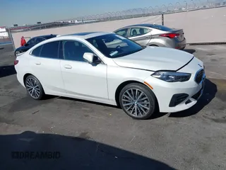 2023 BMW 2 Series 228i with VIN WBA53AK00P7M12823, listed as a IAAI auction lot 42093921 with 24,577 mi miles. Bid and sale history available at carsss.com. Image 1.