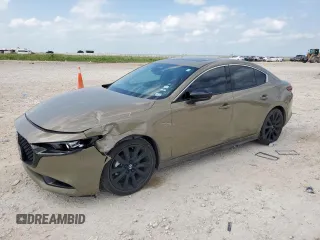 2024 Mazda 3 Carbon Edition with VIN 3MZBPBXYXRM409075, listed as a Copart auction lot 59189265 with 23,114 mi miles and Salvage title. Bid and sale history available at DreamBid. Image 1.