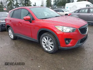 2015 Mazda CX-5 Grand Touring with VIN JM3KE4DY0F0479392, listed as a IAAI auction lot 41659415 with 141,403 mi miles. Bid and sale history available at carsss.com. Image 1.