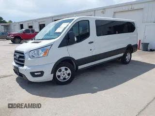 2020 Ford Transit Passenger XL z VIN 1FBAX2Y88LKA32505, wystawiony jako IAAI lot #42480103 z przebiegiem 80 204 mil mil oraz . Historia ofert i sprzedaży dostępna na DreamBid. Obrazek 2.