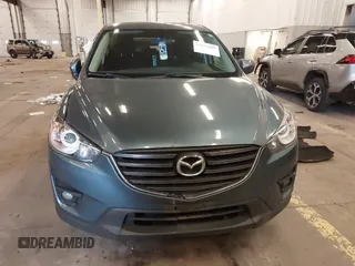2016 Mazda CX-5 Touring z VIN JM3KE4CY2G0839202, wystawiony jako IAAI lot #41901207 z przebiegiem 65 449 mil mil oraz . Historia ofert i sprzedaży dostępna na DreamBid. Obrazek 13.
