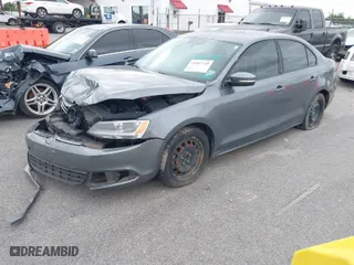 2014 Volkswagen Jetta Sedan SE with VIN 3VWD07AJ1EM271717, listed as a IAAI auction lot 41987749 with 142,296 mi miles. Bid and sale history available at carsss.com. Image 2.