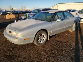 1998 Oldsmobile 88 LS z VIN 1G3HN52K7W4850368, wystawiony jako Copart lot #77761034 z przebiegiem 329 888 mil mil oraz Szkody całkowita. Historia ofert i sprzedaży dostępna na DreamBid. Obrazek 1.