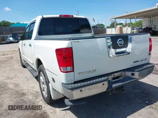 2010 Nissan Titan SE with VIN 1N6BA0ED4AN323907, listed as a IAAI auction lot 42113512 with 198,530 mi miles. Bid and sale history available at carsss.com. Image 3.