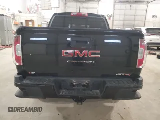 2021 GMC Canyon 4WD AT4 w/Cloth with VIN 1GTG6FEN2M1265863, listed as a Copart auction lot 49900865 with 50,102 mi miles and Salvage Title. Bid and sale history available at carsss.com. Image 6.
