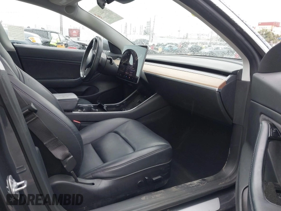 2018 Tesla Model 3 Long Range Battery with VIN 5YJ3E1EB7JF114305, listed as a IAAI auction lot 41765994 with 76,945 mi miles and . Bid and sale history available at DreamBid. Image 5.
