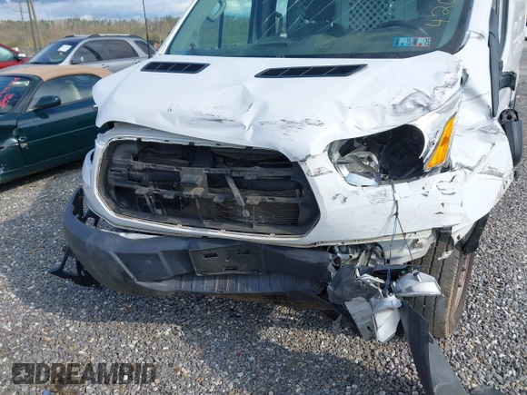 2016 Ford Transit Cargo with VIN 1FTYR1ZM2GKA38963, listed as a IAAI auction lot 42027447 with 70,659 mi miles and . Bid and sale history available at DreamBid. Image 6.