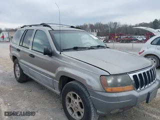 1999 Jeep Grand Cherokee Laredo with VIN 1J4GW58N4XC676836, listed as a IAAI auction lot 41799381 with 203,784 mi miles. Bid and sale history available at carsss.com. Image 1.