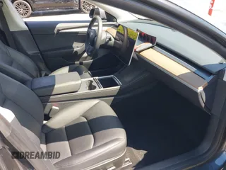 2023 Tesla Model 3 Long Range with VIN 5YJ3E1EB4PF635328, listed as a IAAI auction lot 41978099 with 32,747 mi miles and . Bid and sale history available at DreamBid. Image 5.