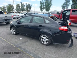 2014 Ford Fiesta SE z VIN 3FADP4BJ0EM216922, wystawiony jako IAAI lot #42255776 z przebiegiem 87 371 mil mil oraz . Historia ofert i sprzedaży dostępna na DreamBid. Obrazek 3.