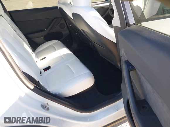 2023 Tesla Model Y Performance with VIN 7SAYGDEF2PF754938, listed as a IAAI auction lot 42067041 with 21,103 mi miles and . Bid and sale history available at DreamBid. Image 8.
