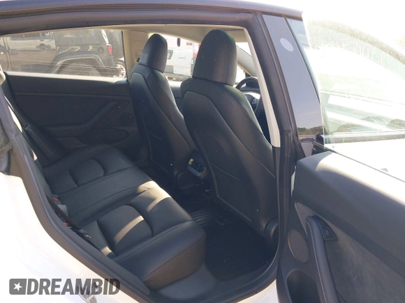 2023 Tesla Model 3 with VIN 5YJ3E1EA3PF617460, listed as a IAAI auction lot 42154401 with 9,578 mi miles and . Bid and sale history available at DreamBid. Image 8.