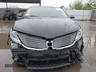 2015 Lincoln MKZ z VIN 3LN6L2G90FR621891, wystawiony jako IAAI lot #41968088 z przebiegiem 128 988 mil mil oraz . Historia ofert i sprzedaży dostępna na DreamBid. Obrazek 6.
