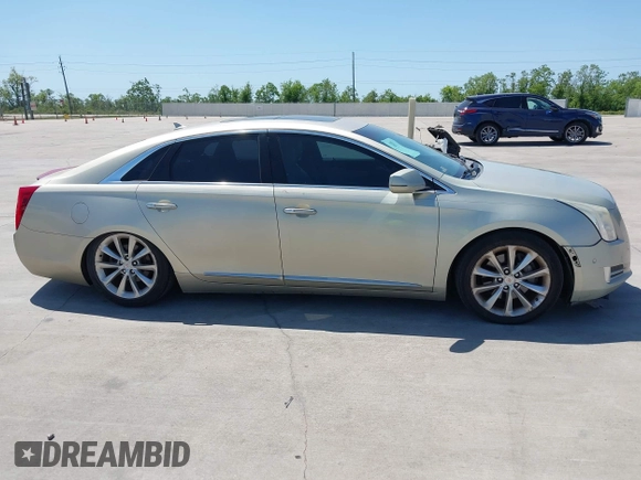 2014 Cadillac XTS Premium with VIN 2G61P5S33E9157607, listed as a IAAI auction lot 42004612 with 111,047 mi miles and . Bid and sale history available at DreamBid. Image 13.