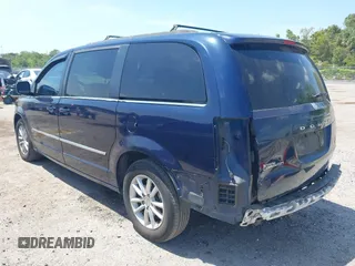 2014 Dodge Grand Caravan SXT with VIN 2C4RDGCG3ER266199, listed as a IAAI auction lot 42119064 with 148,067 mi miles and . Bid and sale history available at DreamBid. Image 3.