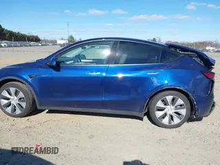 2023 Tesla Model Y Long Range with VIN 7SAYGDEE3PF674457, listed as a IAAI auction lot 41822138 with 43,901 mi miles. Bid and sale history available at carsss.com. Image 13.