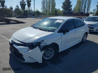 2021 Toyota Corolla Hybrid LE with VIN JTDEAMDE6MJ032371, listed as a IAAI auction lot 42086942 with 68,335 mi miles. Bid and sale history available at carsss.com. Image 6.