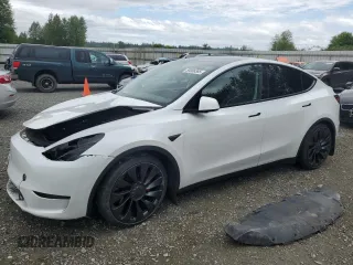 2022 Tesla Model Y Performance z VIN 7SAYGDEFXNF396758, wystawiony jako Copart lot #59006365 z przebiegiem 47 882 mil mil oraz Szkoda całkowita • Salvage title. Historia ofert i sprzedaży dostępna na DreamBid. Obrazek 1.