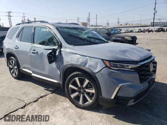 2023 Honda Pilot Touring with VIN 5FNYG2H7XPB011420, listed as a Copart auction lot 69799314 with 9,601 mi miles and Salvage Title. Bid and sale history available at DreamBid. Image 4.