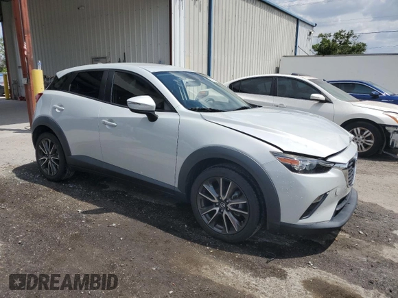 2017 Mazda CX-3 Touring z VIN JM1DKDC78H0150588, wystawiony jako Copart lot #55284205 z przebiegiem 78 923 mil mil oraz Szkoda całkowita • Salvage title. Historia ofert i sprzedaży dostępna na DreamBid. Obrazek 4.
