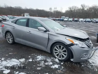 2014 Hyundai Azera Limited with VIN KMHFH4JG6EA361378, listed as a IAAI auction lot 41557210 with 58,561 mi miles and . Bid and sale history available at carsss.com. Image 1.