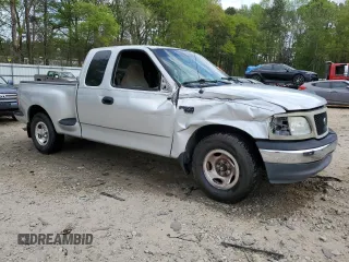 2000 Ford F-150 XL with VIN 1FTRX07W3YKA40036, listed as a Copart auction lot 51795085 with Not provided miles and Salvage title. Bid and sale history available at DreamBid. Image 4.