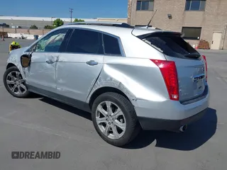2011 Cadillac SRX Premium Collection z VIN 3GYFNFEYXBS599279, wystawiony jako IAAI lot #42372367 z przebiegiem 97 888 mil mil oraz . Historia ofert i sprzedaży dostępna na DreamBid. Obrazek 3.