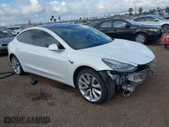 2019 Tesla Model 3 Long Range with VIN 5YJ3E1EBXKF512710, listed as a IAAI auction lot 42063737 with 90,721 mi miles and . Bid and sale history available at DreamBid. Image 1.