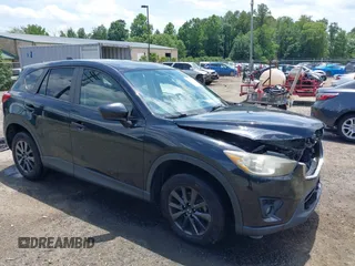 2014 Mazda CX-5 Touring with VIN JM3KE2CY3E0382689, listed as a IAAI auction lot 42551302 with 99,396 mi miles and . Bid and sale history available at DreamBid. Image 1.