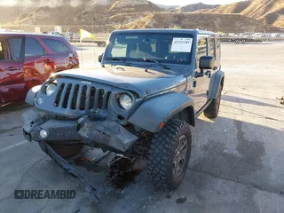 2014 Jeep Wrangler Unlimited Rubicon X with VIN 1C4BJWFG3EL134522, listed as a IAAI auction lot 41221381 with 66,897 mi miles and . Bid and sale history available at DreamBid. Image 17.