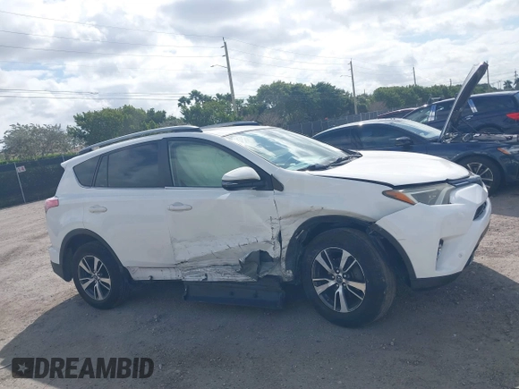 2018 Toyota RAV4 XLE with VIN JTMWFREV7JJ731893, listed as a IAAI auction lot 41567850 with 141,269 mi miles. Bid and sale history available at carsss.com. Image 13.