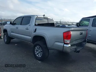 2018 Toyota Tacoma SR5 with VIN 5TFAZ5CN6JX057889, listed as a IAAI auction lot 41449604 with 114,888 mi miles and . Bid and sale history available at DreamBid. Image 3.