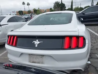2016 Ford Mustang V6 with VIN 1FA6P8AM2G5292940, listed as a IAAI auction lot 41530716 with 96,876 mi miles and . Bid and sale history available at carsss.com. Image 16.
