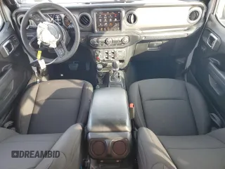 2023 Jeep Wrangler Willys with VIN 1C4HJXDG2PW671483, listed as a Copart auction lot 46990395 with 15,087 mi miles and Salvage Title. Bid and sale history available at DreamBid. Image 8.