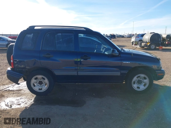 2003 Suzuki Vitara z VIN 2S3TE52V436101091, wystawiony jako IAAI lot #41472279 z przebiegiem 163 429 mil mil oraz . Historia ofert i sprzedaży dostępna na DreamBid. Obrazek 13.