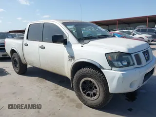 2004 Nissan Titan LE with VIN 1N6AA07A34N570788, listed as a IAAI auction lot 41823592 with 228,344 mi miles. Bid and sale history available at carsss.com. Image 1.