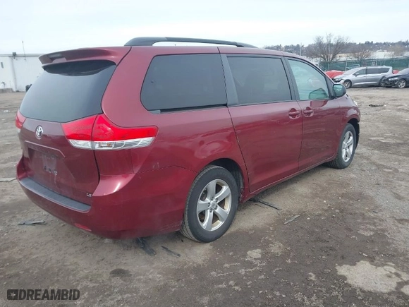 2014 Toyota Sienna LE AAS with VIN 5TDKK3DC6ES433383, listed as a IAAI auction lot 41607527 with 115,235 mi miles. Bid and sale history available at carsss.com. Image 4.