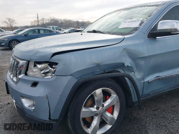 2013 Jeep Grand Cherokee Overland with VIN 1C4RJFCT2DC572978, listed as a IAAI auction lot 41468915 with 223,528 mi miles. Bid and sale history available at carsss.com. Image 6.