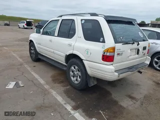 1998 Isuzu Rodeo S with VIN 4S2CM58W0W4331738, listed as a IAAI auction lot 42074562 with 237,684 mi miles. Bid and sale history available at carsss.com. Image 3.