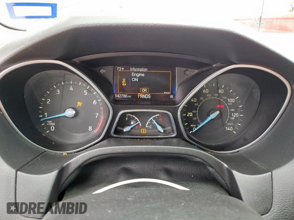 2015 Ford Focus SE z VIN 1FADP3F29FL357021, wystawiony jako Copart lot #57985125 z przebiegiem 142 786 mil mil oraz Szkoda całkowita • Salvage title. Historia ofert i sprzedaży dostępna na DreamBid. Obrazek 9.