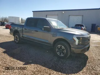 2023 Ford F-150 Lightning Pro with VIN 1FTVW1EL8PWG10894, listed as a Copart auction lot 50988655 with 34,020 mi miles and Salvage Title. Bid and sale history available at DreamBid. Image 4.