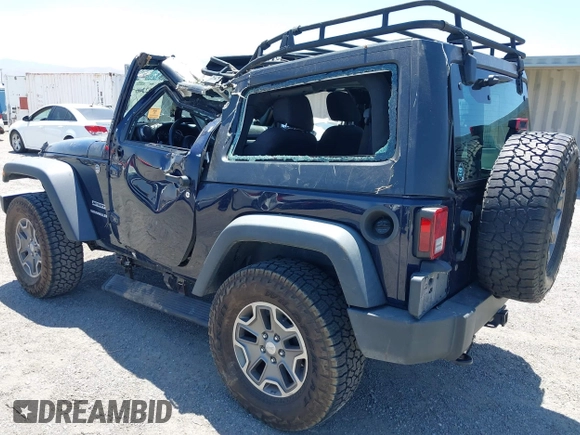 2013 Jeep Wrangler Sport with VIN 1C4AJWAG3DL627179, listed as a IAAI auction lot 42262246 with 33,536 mi miles and . Bid and sale history available at DreamBid. Image 3.