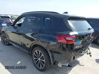 2021 BMW X5 xDrive40i with VIN 5UXCR6C01M9E66976, listed as a IAAI auction lot 42024110 with 67,877 mi miles and . Bid and sale history available at DreamBid. Image 3.
