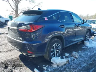 2021 Lexus RX with VIN 2T2HZMDA4MC277227, listed as a IAAI auction lot 41527380 with 52,580 mi miles. Bid and sale history available at carsss.com. Image 4.