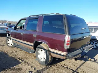1996 Chevrolet Tahoe with VIN 1GNEK13R9TJ336722, listed as a IAAI auction lot 41576273 with 163,609 mi miles. Bid and sale history available at carsss.com. Image 3.