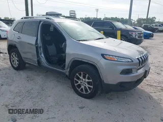 2014 Jeep Cherokee Altitude with VIN 1C4PJMCB4EW107556, listed as a IAAI auction lot 41881448 with 212,816 mi miles and . Bid and sale history available at carsss.com. Image 1.